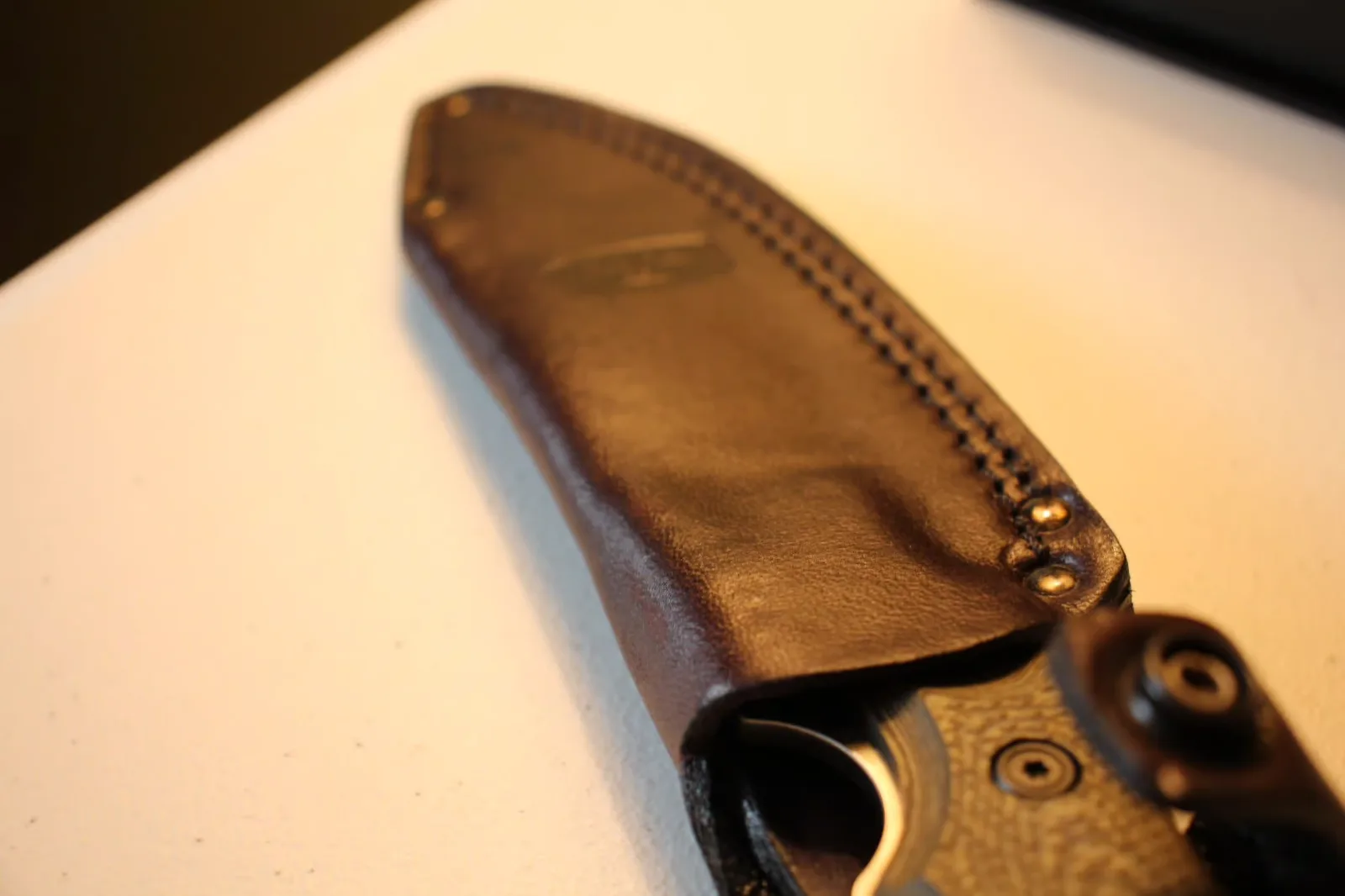 Sheath top view showing leather stitching detail