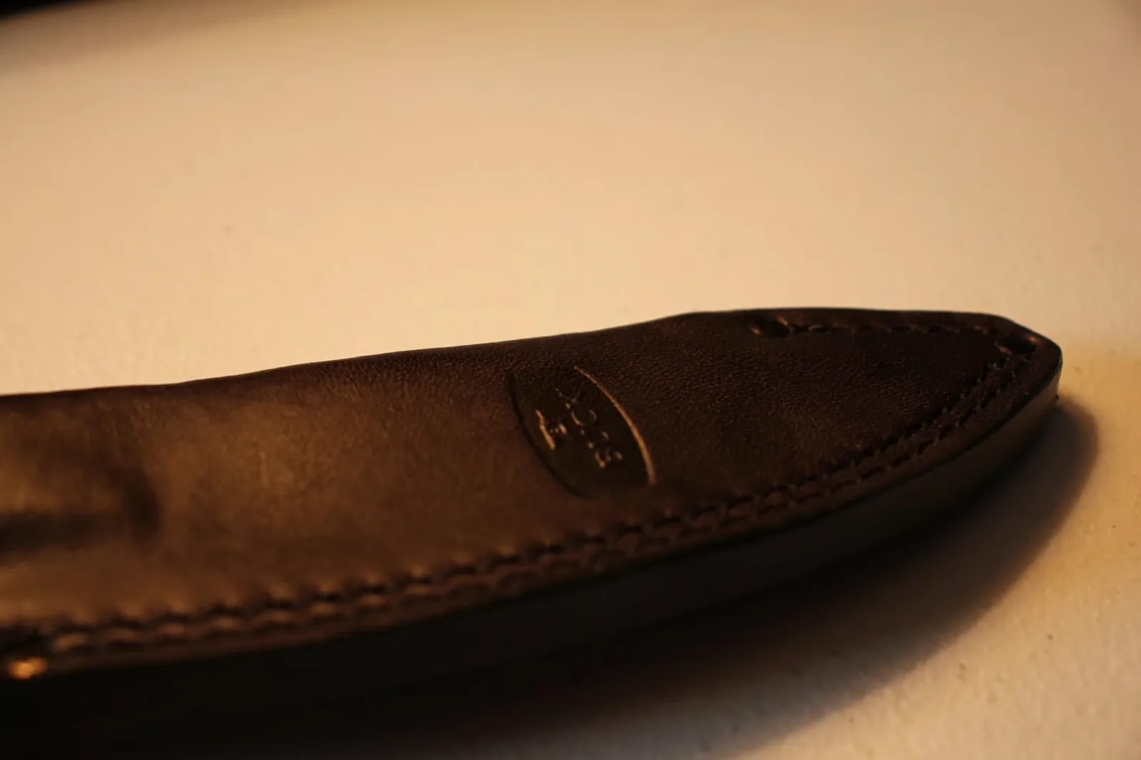 Side profile of the leather sheath with BUCK logo