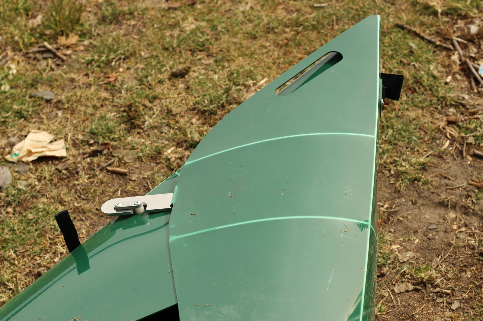 Bow detail of the assembled Tucktec hull showing the pointed geometry with a metal latch visible on the side